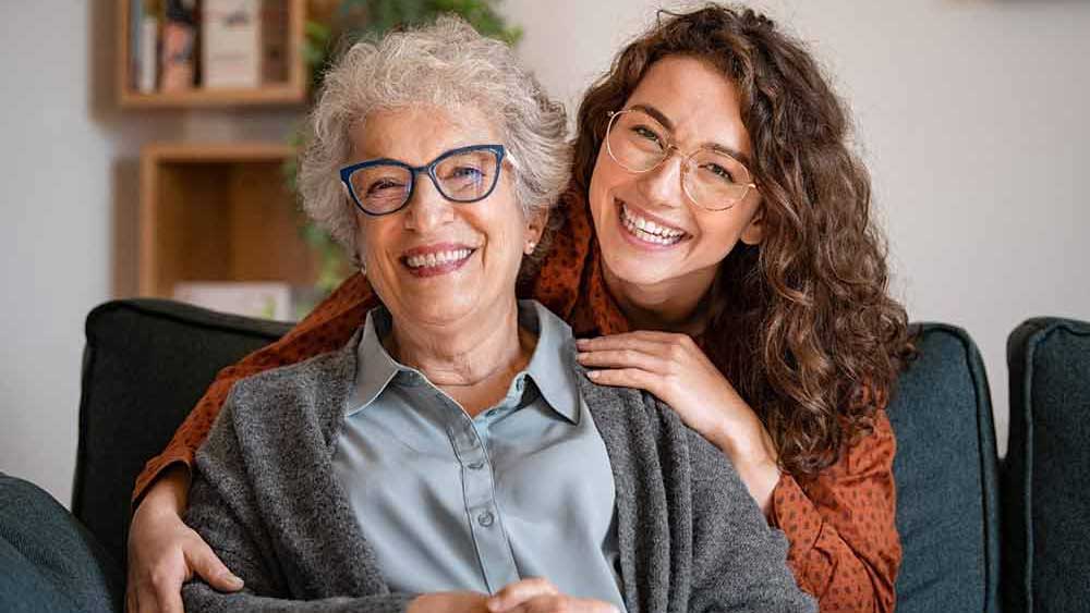 smiling senior and younger ladies